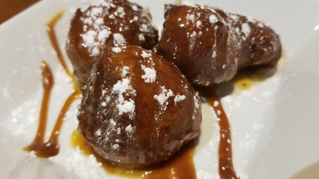 Funky Punkin Chunks · Why did Linus wait so long every Halloween night in the Pumpkin Patch? To meet the Great Pumpkin! But it was only so he could get the recipe to these fritters!! These are pumpkin and spice flavored donut balls, rolled in cinnamon and lovingly glazed!