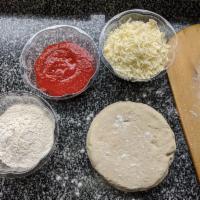 at home pizza kit · Pizza dough, sauce, mozzarella, flour, and your choice of toppings so that you can make a pi...
