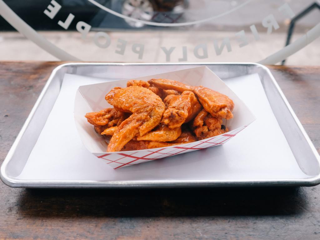 chicken wings  · 8 wings tossed in spicy buffalo or homemade bbq sauce