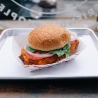 crispy chicken sandwich · includes lettuce, tomato and onion on a sesame seed bun
