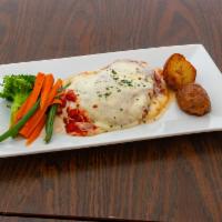 Chicken Parm · Breaded cutlet, mozzarella cheese and meat sauce.