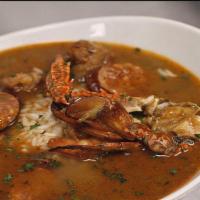 Seafood Gumbo · Homemade Louisiana style gumbo with blue crab, shrimp, chicken, sausage okra, and corn serve...