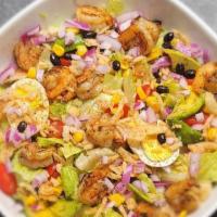 Shrimp Southwestern Salad · Grilled shrimp, mixed lettuce leaves, tomatoes chopped, avocado, red onion, corn, french oni...