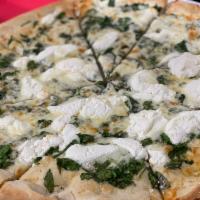 White Spinach Pizza · Spinach, mozzarella, ricotta, provolone, garlic and oil. 