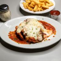 Veal Parmigiana · Tender breaded veal topped with tomato sauce and mozzarella cheese.