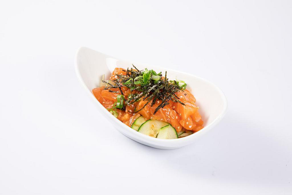 Zuke Sake · Marinated salmon, cucumber, scallion, nori (seaweed) topped with sesame seed and a kim-chi dressing. Spicy.