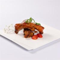 Baby Back Ribs (3 pcs) · Slow cooked porkl ribs with tamarind chili glaze.