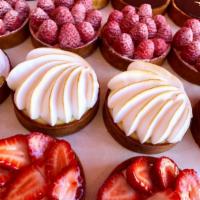 Raspberry Tartelette (New!) · Shortcrust, almond biscuit, raspberry coulis, fresh raspberries
