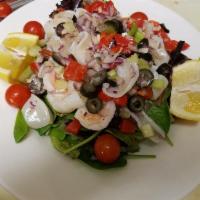 Seafood Salad · Steamed calamari, shrimp and homemade lemon oil dressing over spring mix.