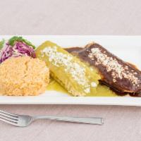 Tamale Plate · 2 steaming tamales with rice and salad. Topped with queso fresco and sauce. Choice of braise...