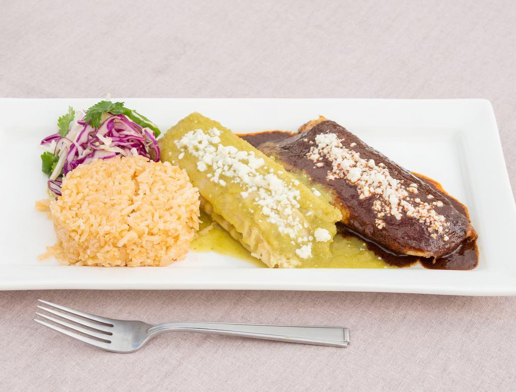 Tamale Plate · 2 steaming tamales with rice and salad. Topped with queso fresco and sauce. Choice of braised pork mole, shredded chicken Chile verde rajas Oaxacan cheese and jalapenos.