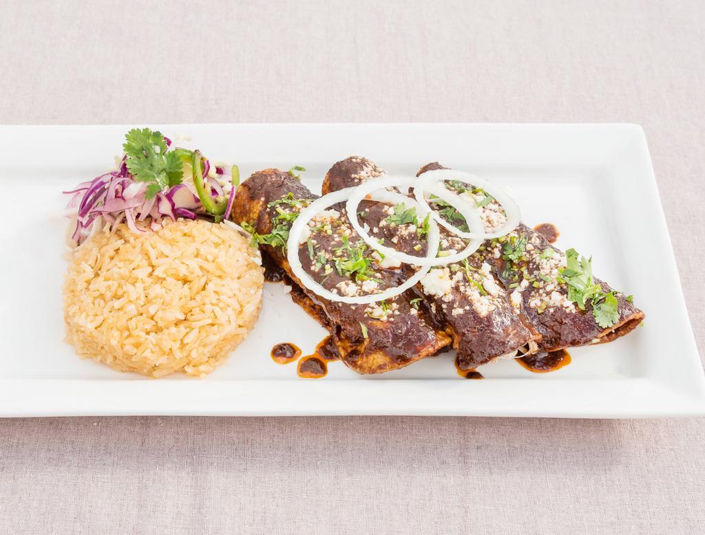 Cheese Enchilada · Three enchilada filled with Oaxacan cheese, topped with mole sauce, queso fresco, onions and cilantro. Served with rice and salad.