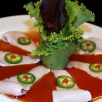 Yellowtail Jalapeno · Yellowtail belly topped with jalapenos and served with chef's special sauce.