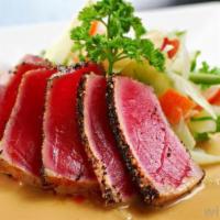 Pepper Tuna · Seared blackened tuna topped with house special sauce.