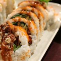 Spider Roll · Soft shell crab, avocado and cucumber with masago on top.