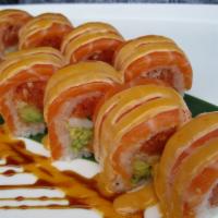 Momiji Roll · Spicy tuna, shrimp, avocado and tempura flakes wrapped in soy paper and topped with salmon a...