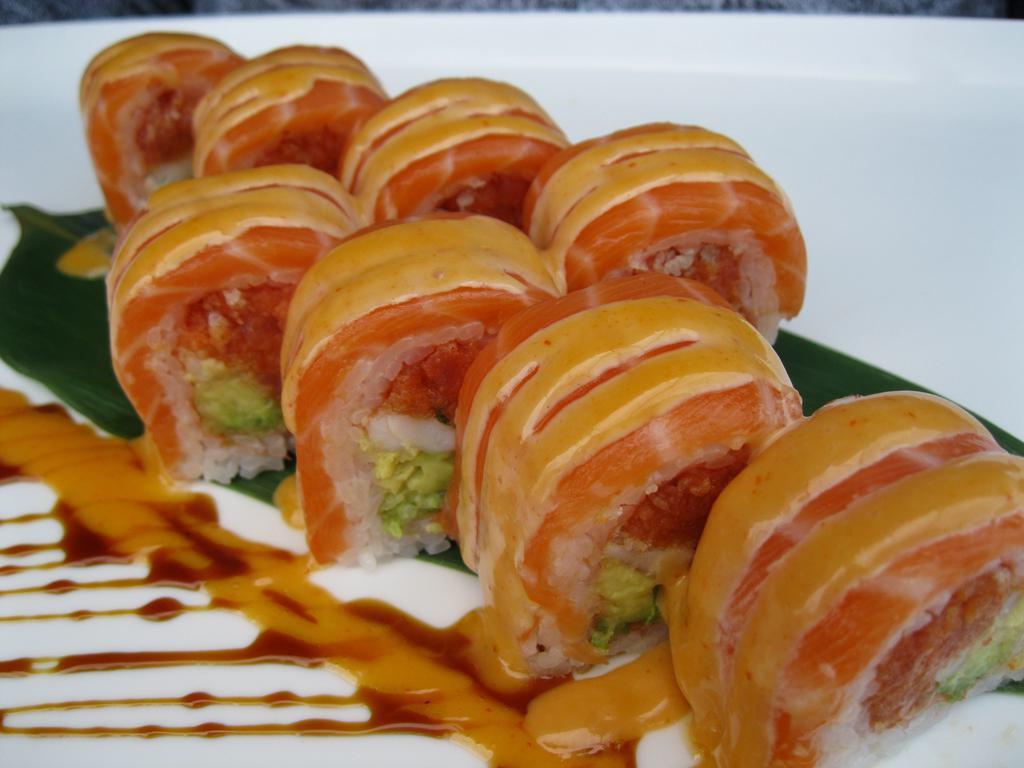 Momiji Roll · Spicy tuna, shrimp, avocado and tempura flakes wrapped in soy paper and topped with salmon and spicy mayonnaise.  
