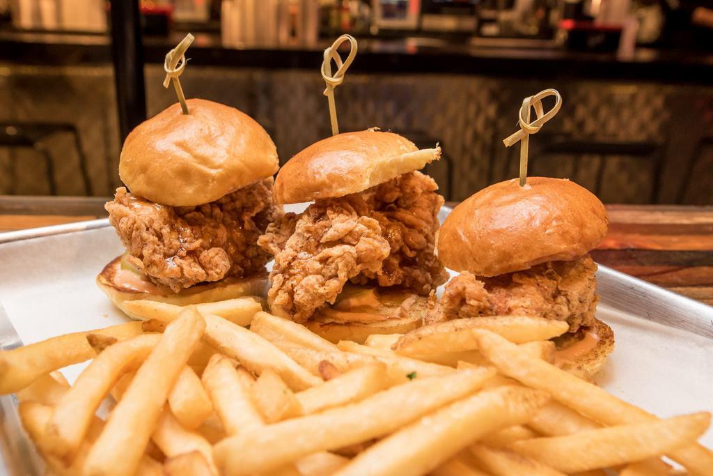 Fried Chicken Sliders & Fries · Served with Fries. 3 Country Fried Chicken Sliders topped with a Spicy Honey drizzle, our Special House Sauce, and Pickles on a Brioche Bun.