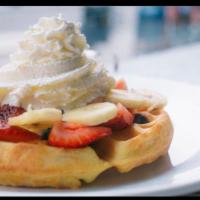 Belgium Waffle Deluxe · Topped with Fresh Mixed Berries, Banana, Nutella, Whipped Cream, and Powdered Sugar. Served ...