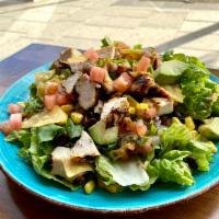 Southwest Chicken Salad · Lettuce topped with Grilled Chicken, Sweet Corn, Black Beans, Pico de Gallo, Avocado, Crumbl...