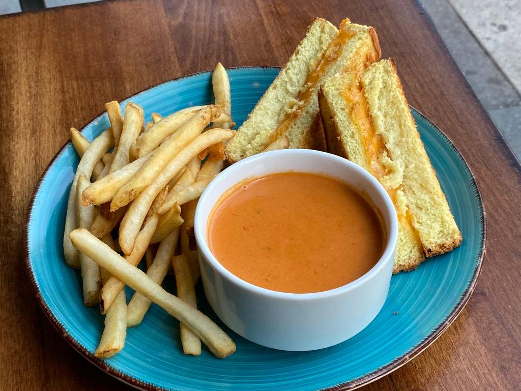 Grilled Cheese & Tomato Soup · Grilled Cheese made with a Three Cheese House Blend. Served with Tomato Soup. Choose Your Side.