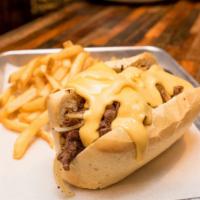 Truffle Philly Cheesesteak · Sliced Ribeye Steak topped with Peppers, Onion, Mushrooms, Melted Cheese, and Truffle Oil se...