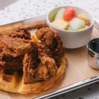 Fried Chicken & Waffles · Country Fried Chicken served on a Belgium Style Waffle with Maple Syrup on the side.