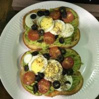 healthy Avocado Toast · Multigrain Bread with avocado mashed, topping with boiled egg, black olives and Cherry tomat...