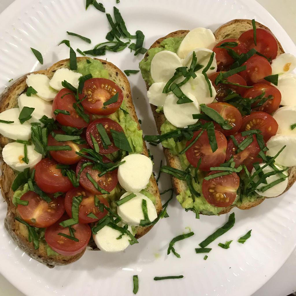 caprese Avocado Toast · multigrain Toast covered with avocado mashed topping Mozzarella cheese, cherry tomatoes, spinach