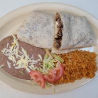 Burrito Dinner · Flour tortilla with a savory filling. Extra meat for an additional charge.