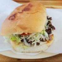 Torta Asada / Steak · Served with beans, lettuce, tomato avocado, and sour cream 