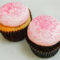 Pink Chocolate Cupcake · Chocolate cake, pink vanilla buttercream, and pink sugar sprinkles.
