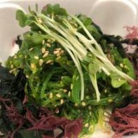 Seaweed Salad · Shredded green seaweed with sesame vinaigrette.