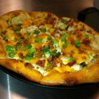 Potato Pizza · Sour cream, potatoes, green onions, bacon and cheddar.