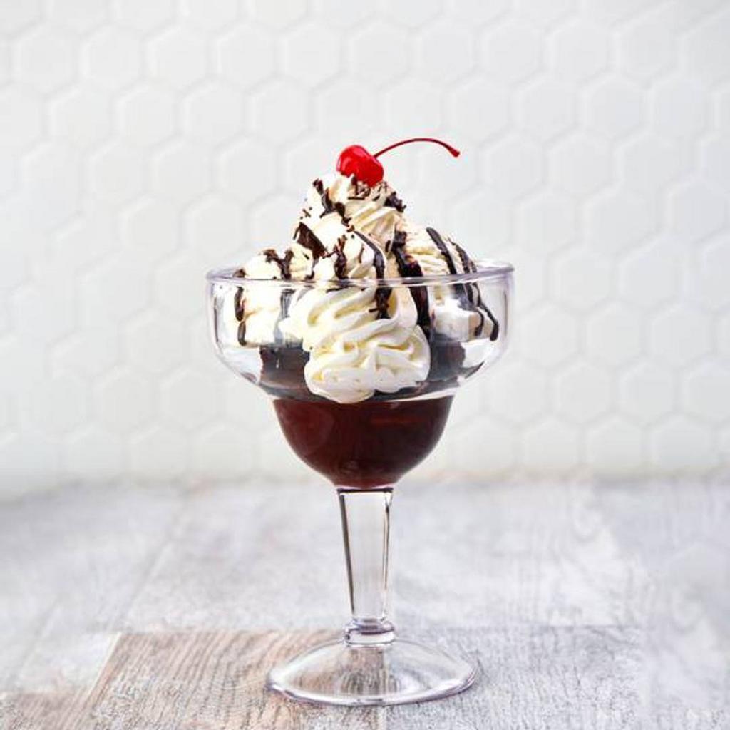 Hot Fudge Brownie · Warm chocolate brownie topped hot fudge, chocolate sprinkles, fresh whipped cream, and a cherry