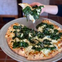 Bianca e Neve Pizza · Organic Spinach, garlic, ricotta and mozzarella cheese.