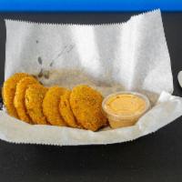 Fried Green Tomatoes · 1 Deep fried green tomatoe. Seasoned to perfection w/ Surf Sauce on the side