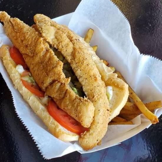 Surfboard Sandwich w/ Fries · 2 pcs. fried whiting fish served on toasted french bread; topped w/ lettuce, tomatoes, and tartar sauce. Fresh cut fries included.