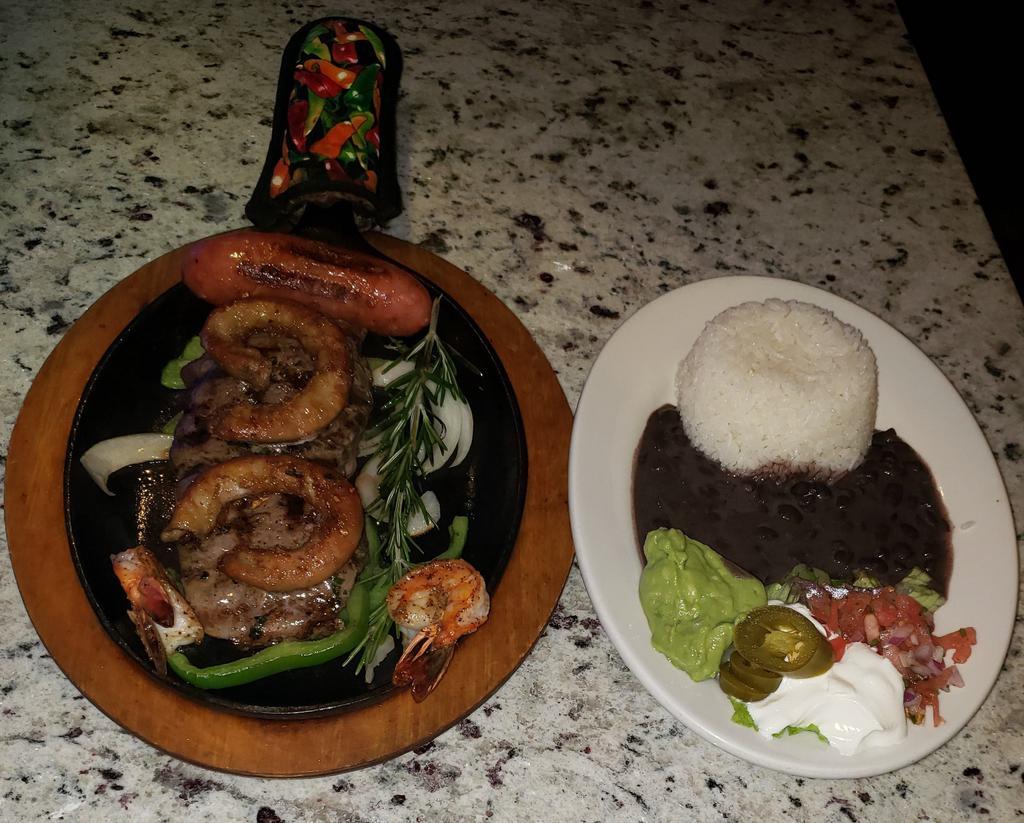 Anejo Mix · Charbroiled 4 oz. chicken, steak or chorizo, rice, beans and salad.