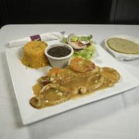 Mariscos a La Plancha Combo · Grilled shrimps, salmon, scallops, calamary tossed with house sauce, rice, beans and salad.
