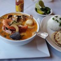 Sopa de Mariscos · Seafood soup, seasoned shrimps, clams, squid, scallops, crab and fish fillet and 2 tortillas.