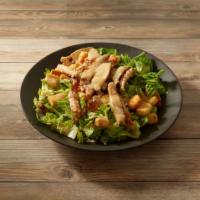 Chicken Caesar Salad · Romaine lettuce, Parmesan cheese, croutons, Caesar dressing and chicken.