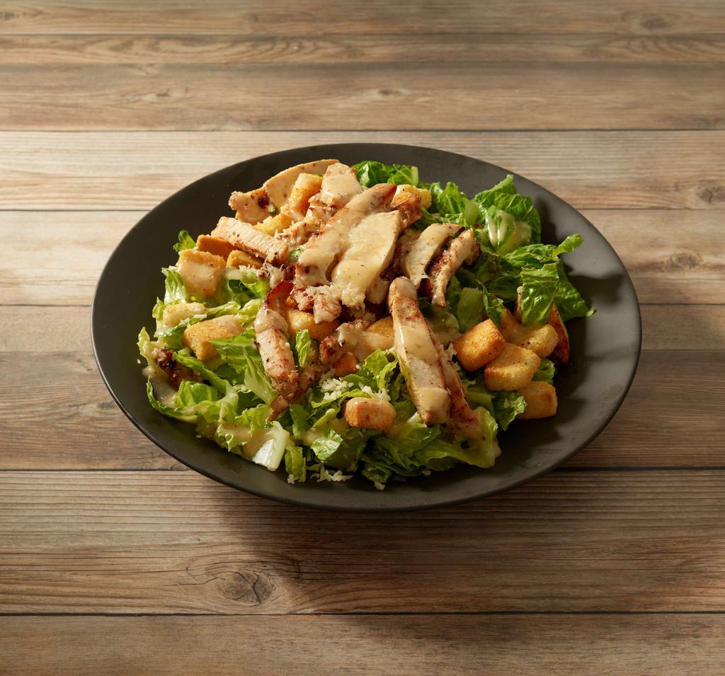 Chicken Caesar Salad · Romaine lettuce, Parmesan cheese, croutons, Caesar dressing and chicken.