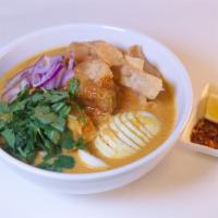 Ohn-No Khao Swe · Coconut chicken curry noodle soup.
A rich and creamy bisque with flour noodles and fried won...