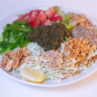Tea Leaf Salad · A mix of Burmese tea leaves, fried garlic, yellow beans, peanuts, sesame seeds, sunflower se...