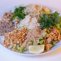 Ginger Salad · Pickled ginger, fried garlic, yellow beans, yellow bean powder, peanuts, sesame seeds, sunfl...