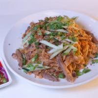 Burmese Garlic Noodles · Egg-flour noodles tossed with fried garlic, scallions, cucumbers, garlic oil and oyster sauc...