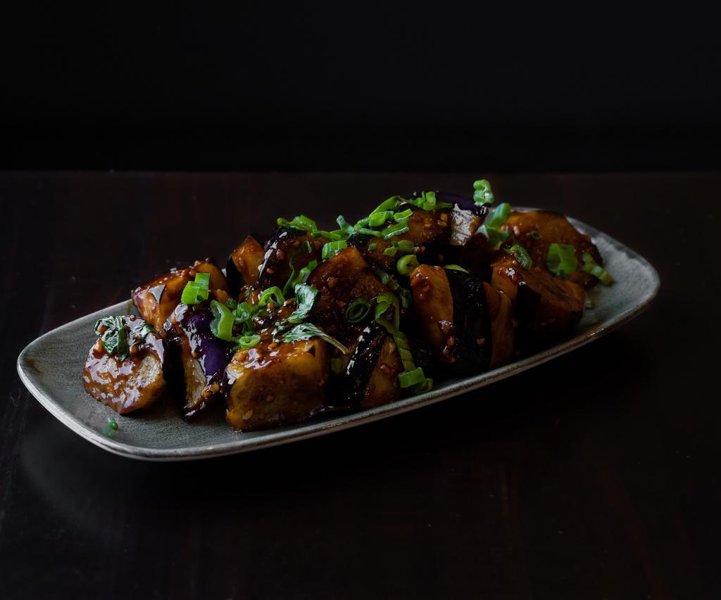 Eggplant ＆ Garlic · Sautéed eggplant with garlic, ginger, scallions, basil, soy sauce, dried chilis, sambal chili, and vinegar. 
Vegan.
Gluten-free option available.