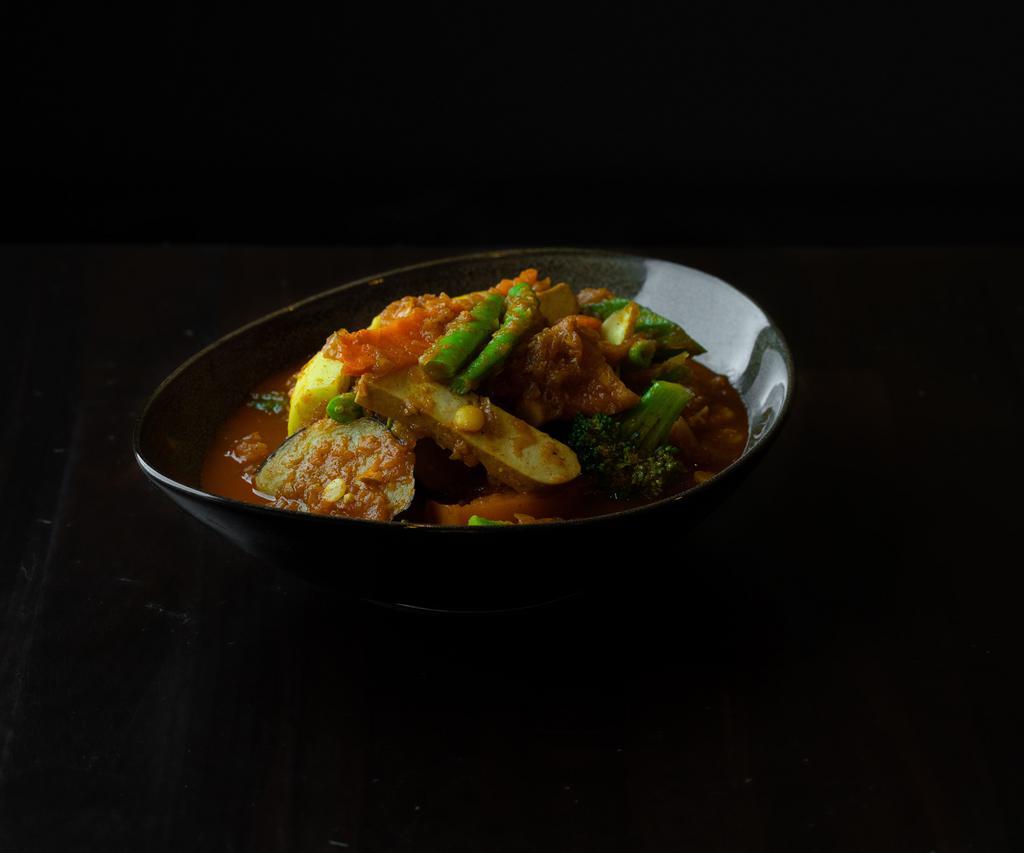 Mix Vegetables Curry · Onion based curry with eggplant, tomatoes string beans, cabbage, broccoli, opo, tofu, ginger, garlic, paprika, turmeric, tamarind and masala. 
Vegan.
Gluten-free.