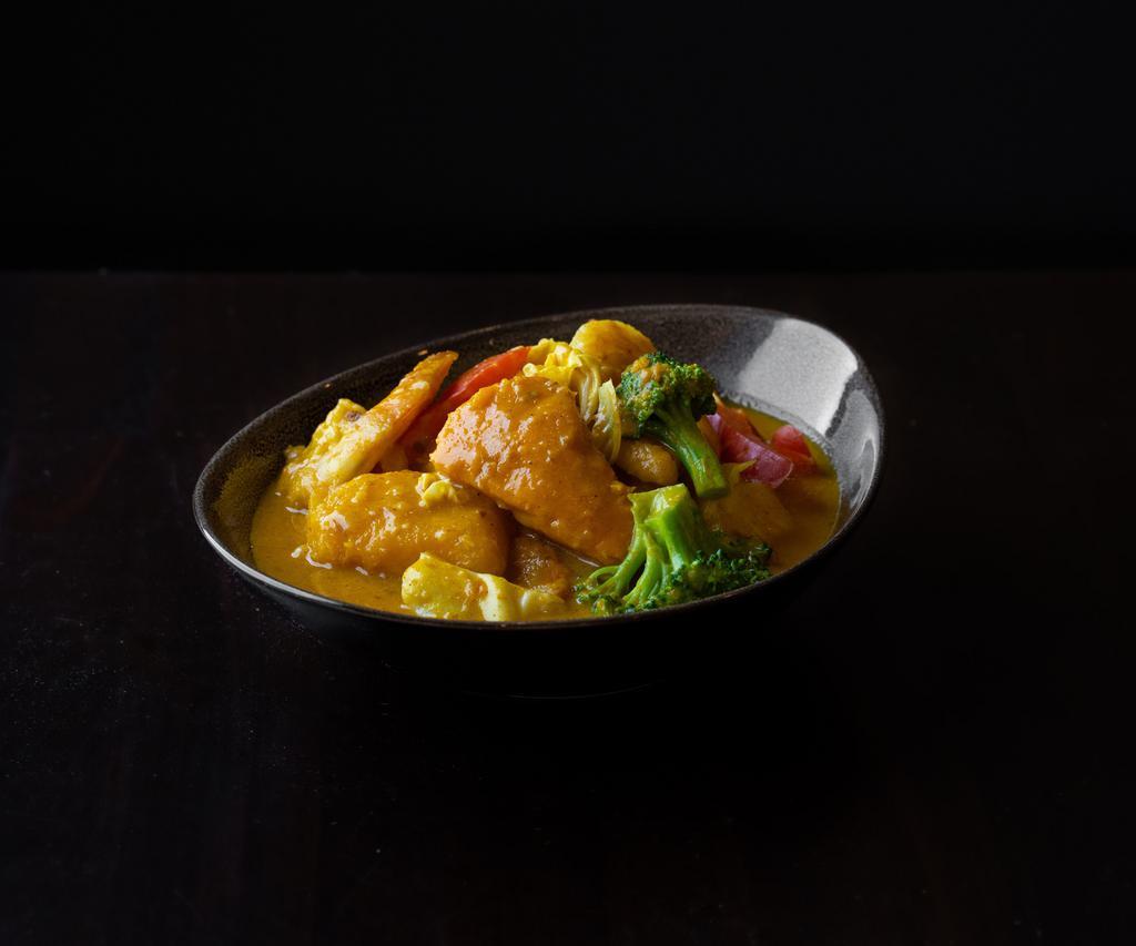 Pumpkin Shrimp Curry · A delicious stew made with shrimp, locally grown pumpkin, fresh onion, garlic, ginger, and Burmese spices. 
Gluten-free.